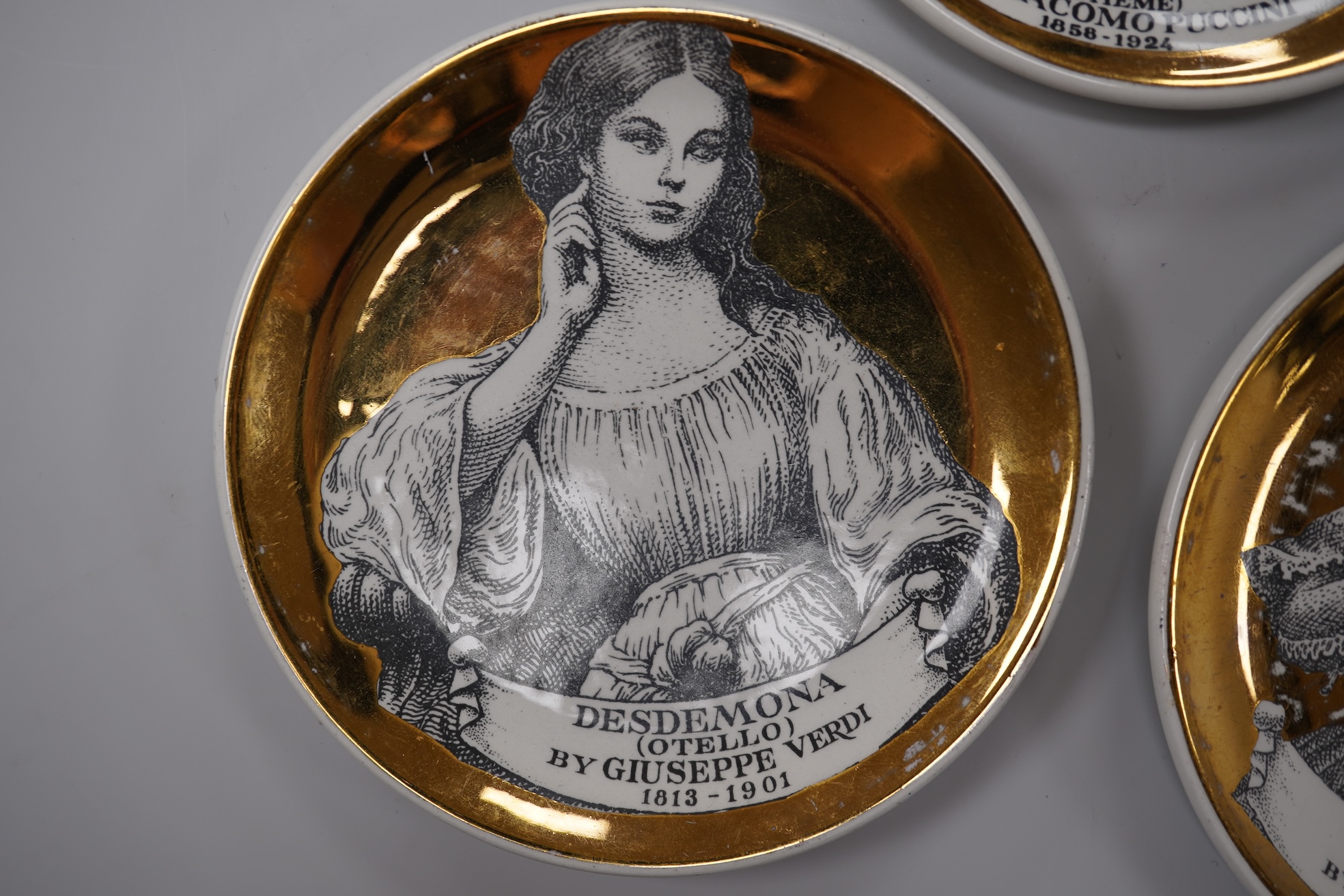 Fornasetti, a group of five operatic coasters, ‘Melodramma’ to include Otello and Desdemona, 10cm in diameter